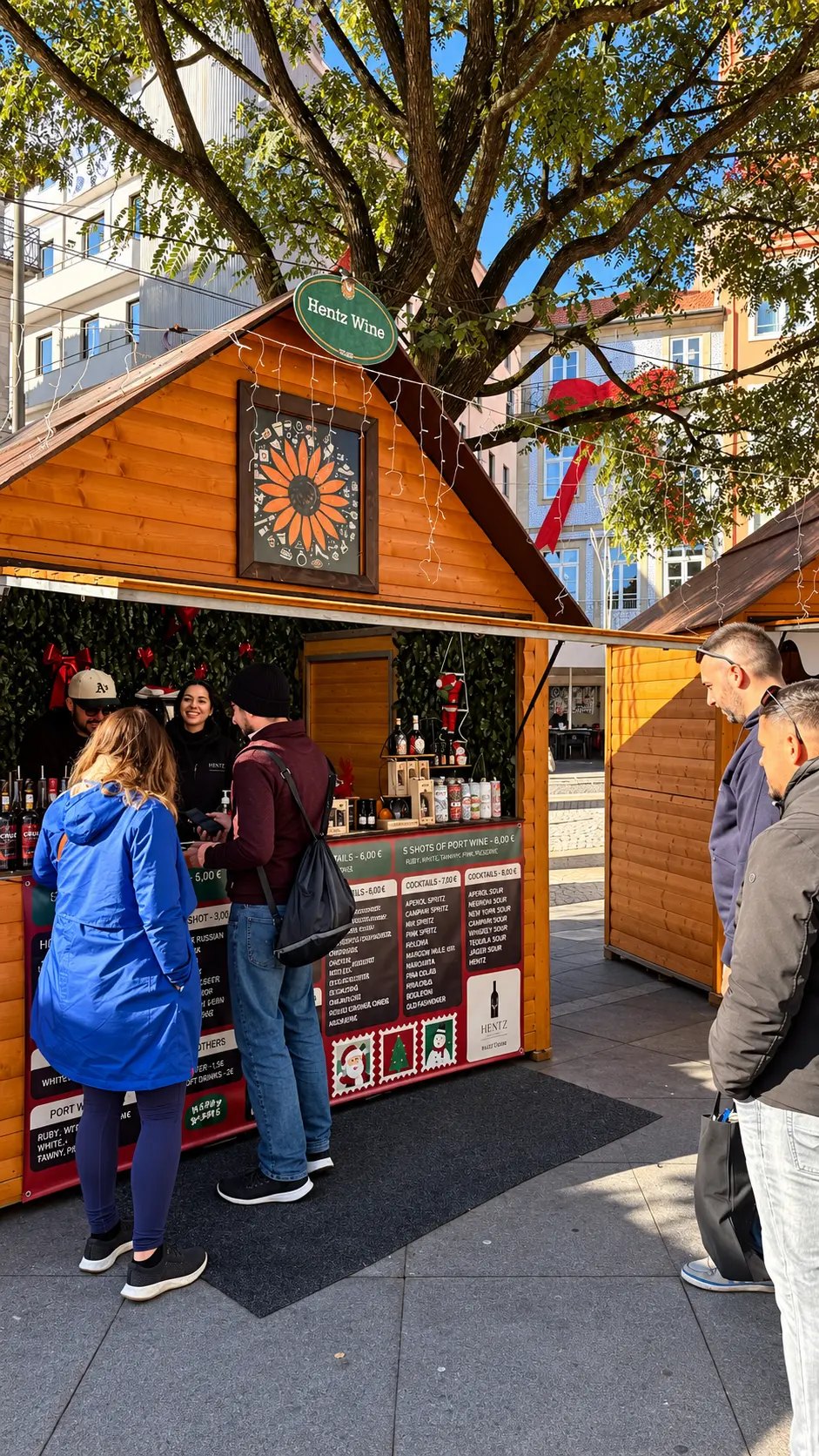 Kiosk Hentz Wine num mercado de Natal, com clientes ao balcão